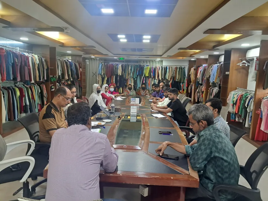 Wellbeing planning session with garment factory management