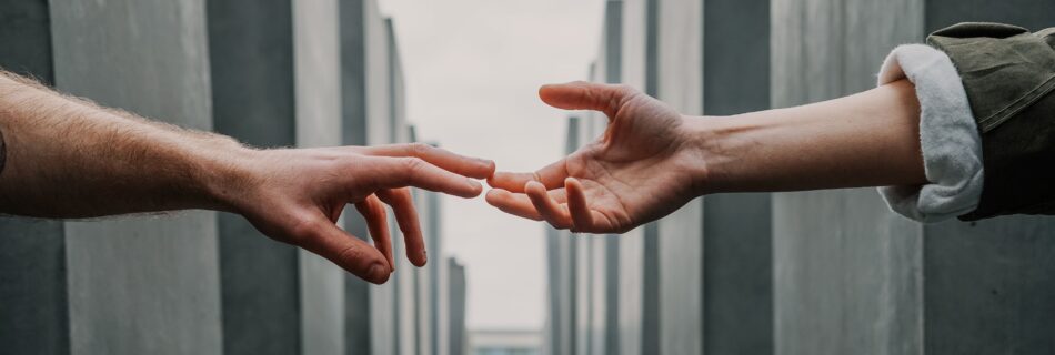 two hands touching each other after they received counselling service from the best psychologist in Bangladesh