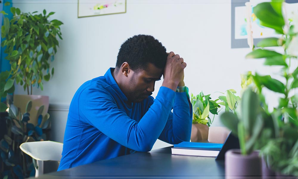 a depressed man tired of list of mental health issues