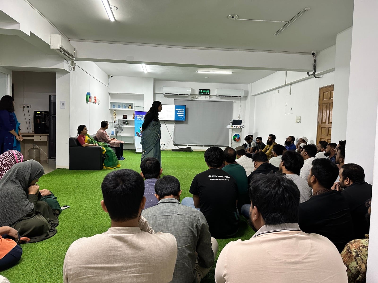 Psychologist leading a Chum Wellness stress-management workshop at weDevs