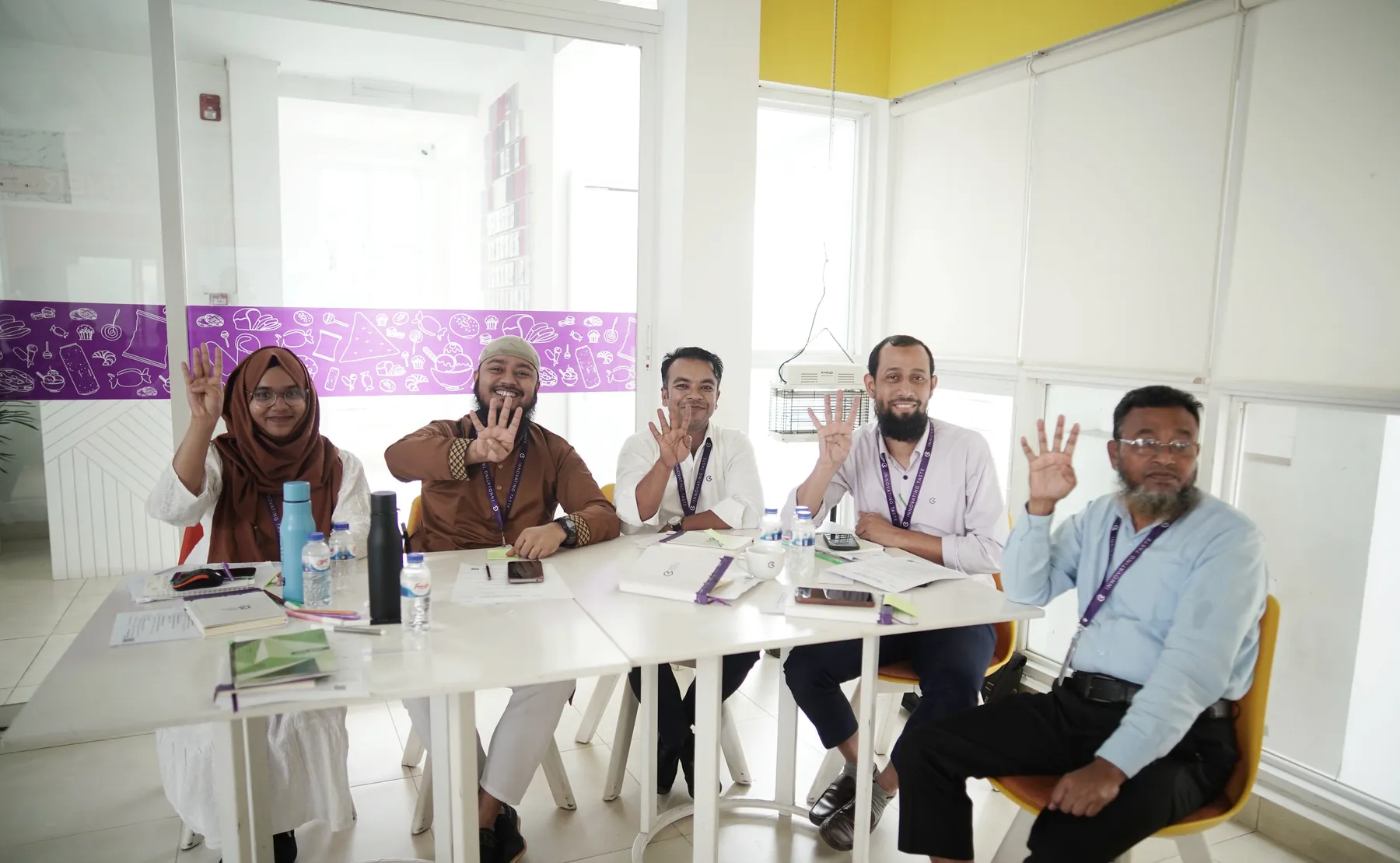 Banga managers raising hands during an interactive activity