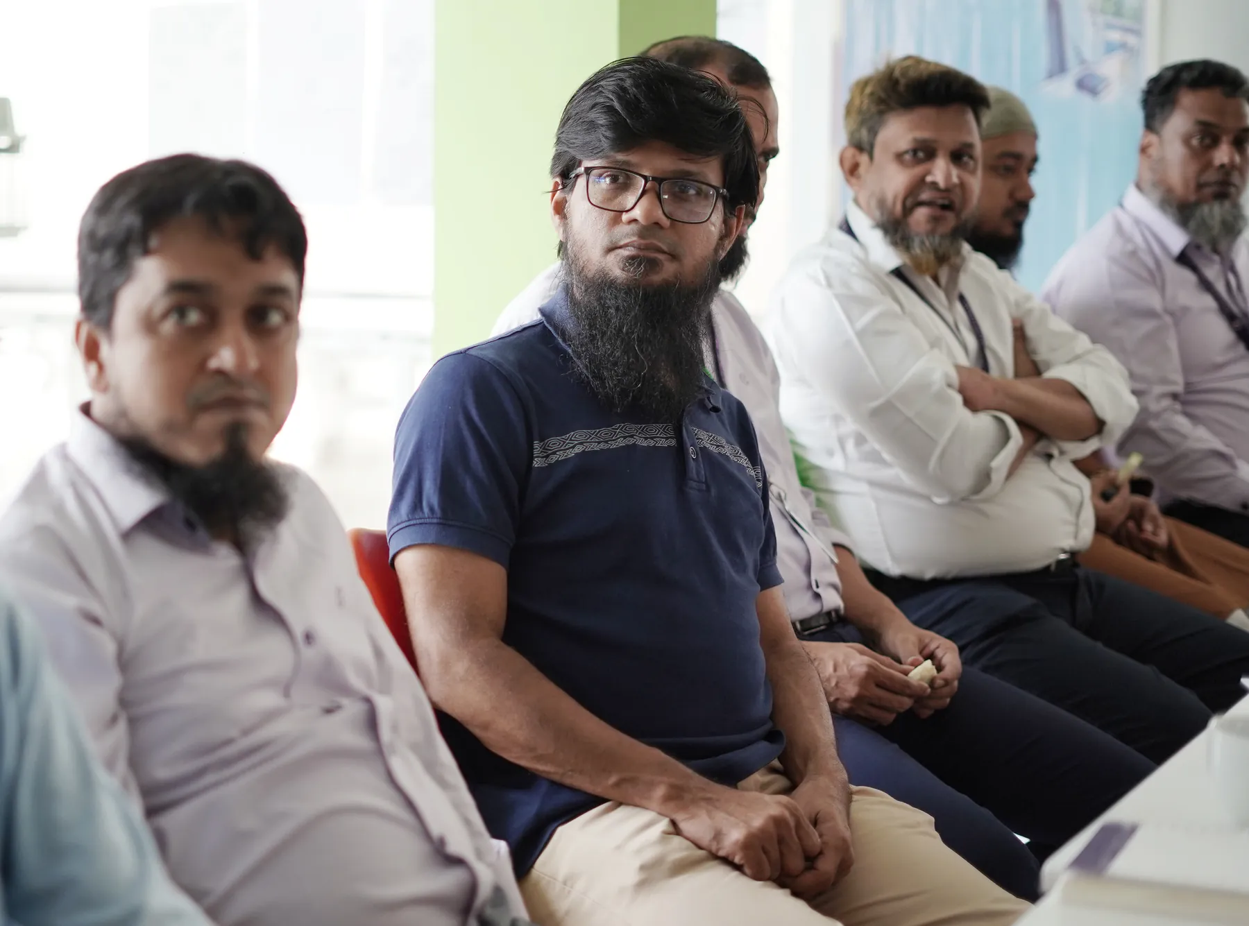 Banga managers listening during a session