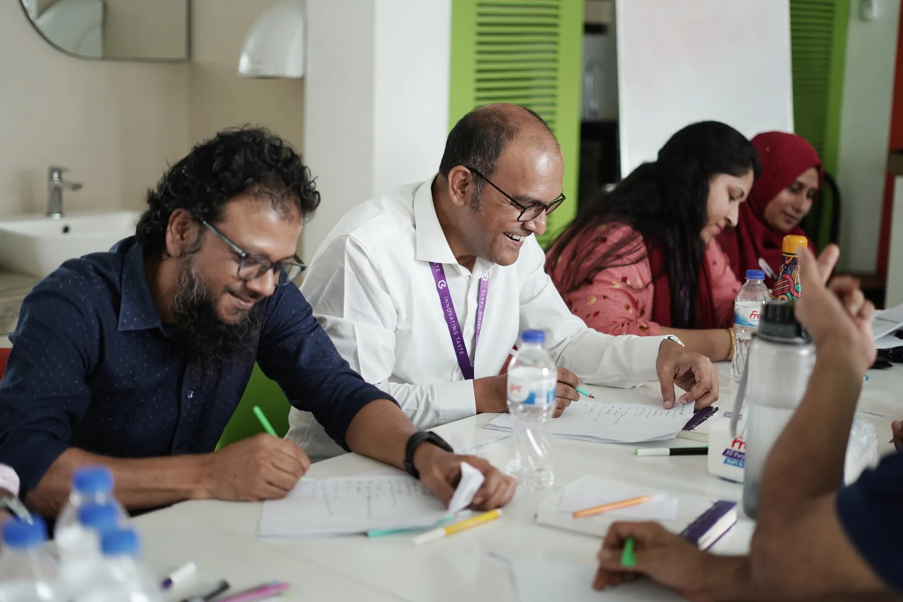 Banga managers writing during a reflection activity